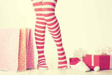 Sexy Santa woman legs. Christmas shopping concept