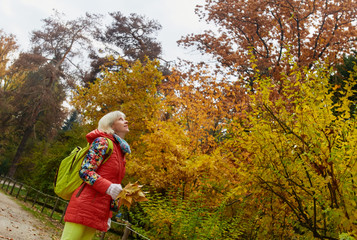 Woman standing in autumn park