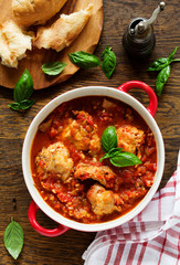 Baked rabbit in tomato sauce with rosemary and basil. Italian Cuisine.