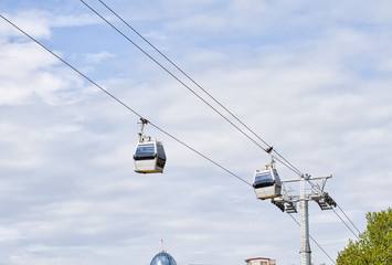 Two cabins cable car against the sky, Tbilisi