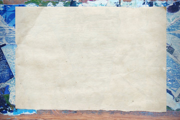 Creative vintage background. Border, frame, template for presentation. Collage on a wooden board. Blue. Craft paper texture