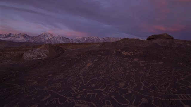 2 axis motion controlled time lapse with dolly in & pan right motion of morning glow over Native American Petroglyphs in Eastern Sierra, California