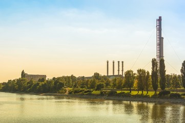 Thermal power plant with trees and blue sky