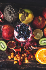 Fresh smoothie on wooden table in the glass