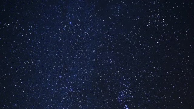 Astro Time Lapse of Constellation Orion over Desert Rocks -Long Shot-