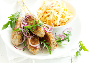 Kyufta kebab with salad close-up.