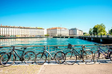 Fotobehang Bicycles on the riverside in the center of Geneva city in Switzerland © rh2010