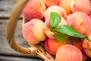 Close up of a basket of ripe peaches