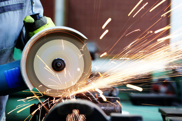 Metal sawing. Grinder