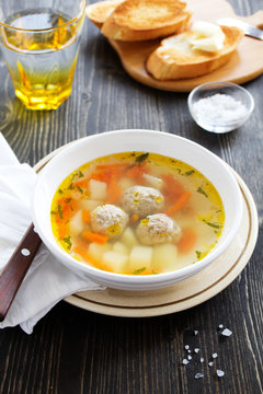 Chicken soup with meatballs.