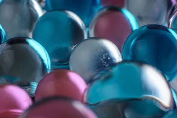Abstract close-up photo of small colored beads with a soft focus
