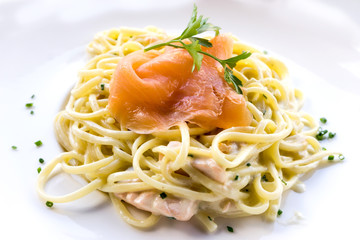tasty pasta with salmon on a the table