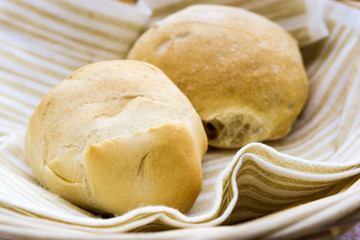 bread in basket - little roll breads in basket on table