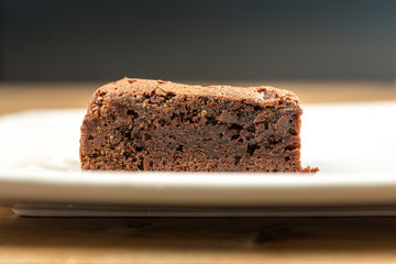 Chocolate Brownie cake on a dark plate