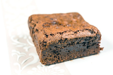 Chocolate Brownie cake on a dark plate