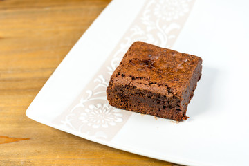 Chocolate Brownie cake on a dark plate