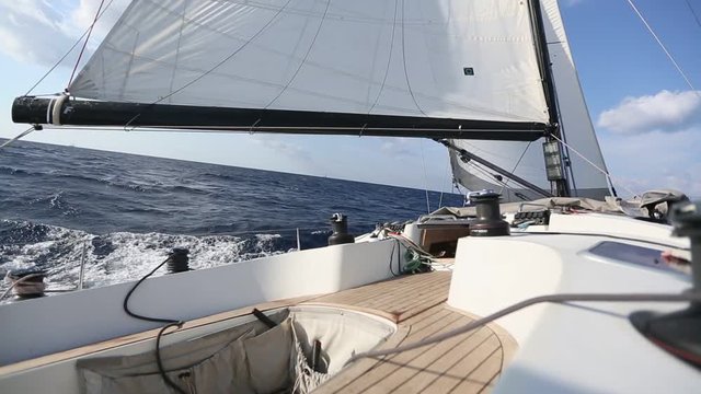 Sailing in the wind through the waves. Luxury yacht boat in race regatta.