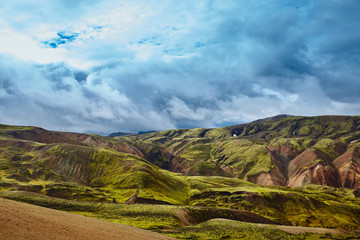 Valley National Park Landmannalaugar. On the gentle slopes of the mountains are snow fields and glaciers. Magnificent Iceland in the August