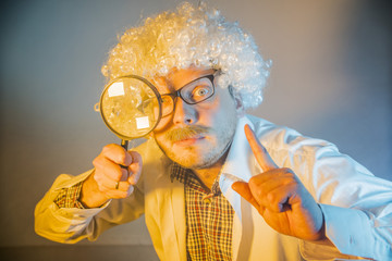 funny scientist, like Einstein with a magnifying glass