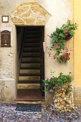 Fototapeta na wymiar Street of the old town of Alghero, Sardinia, Italy