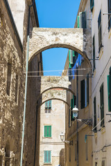 Fototapeta na wymiar Street of the old town of Alghero, Sardinia, Italy