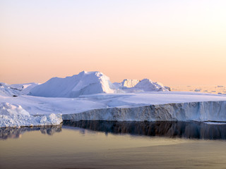 icebergs are in icefjord at Greenland
