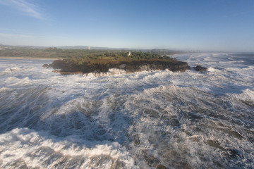 Raging storm waves smashing into rocks