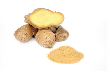 Fresh ginger root and ground ginger isolated spice on white background
