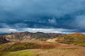 Valley National Park Landmannalaugar. On the gentle slopes of the mountains are snow fields and glaciers. Magnificent Iceland in the August