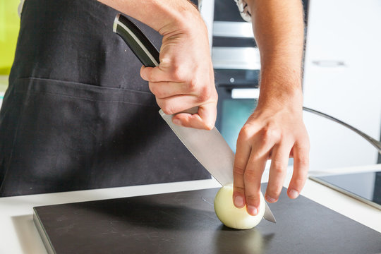 Man slicing onion