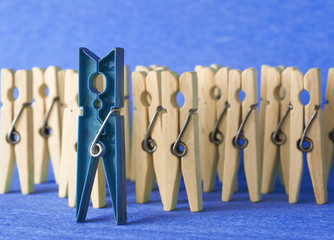 colorful wooden clothespin - selective focus, standing out from the crowd, leadership, difference concept. personality stand out. selective focus image 