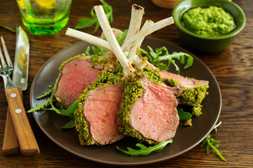 Rack of lamb in herb cheese and breadcrumbs. A festive meal. Selective focus.