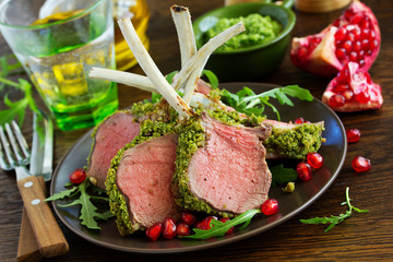 Rack of lamb in herb cheese and breadcrumbs. A festive meal. Selective focus.