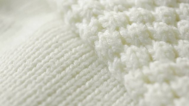 white knitted wool texture. use as background. close-up