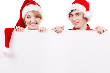 Couple with blank empty banner board. Christmas