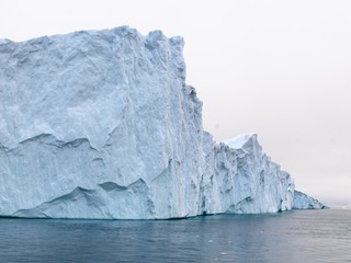 Fototapeta na wymiar Beautiful icebergs are on arctic ocean in icefjord