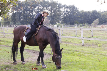 A young girl with a horse