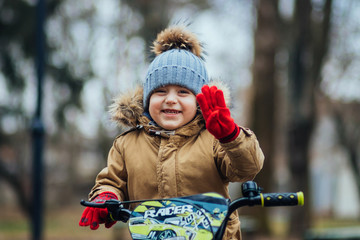 Cute little boy on bike © nicklivyi