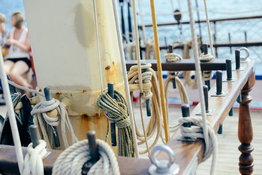Closeup view of ship rope tackles on sunny background outdoors