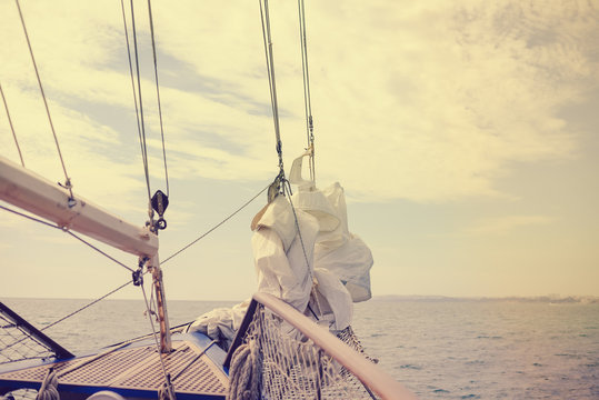 Vintage beautiful sail boat details. Rope, hull, rigging sailing yacht background