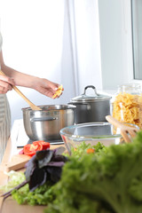 Cook's hands preparing vegetable salad - closeup shot