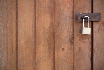 Fototapeta premium Old padlock on a wooden door