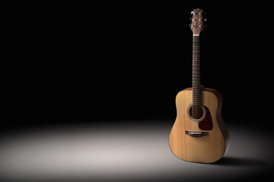 Acoustic guitar on a black background