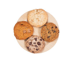 Variety of cookies in bamboo plate isolated on white background