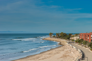 Ventura promenade boardwalk along the high tide shore.