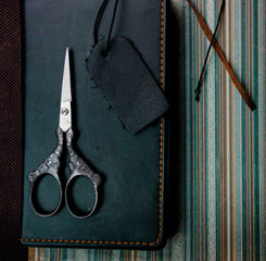 still life. vintage. notebook, scissors on the old paper. close-up © ugchannel