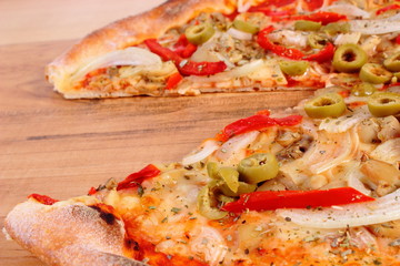 Italian vegetarian pizza on wooden surface