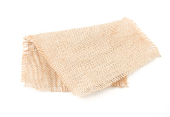 Burlap napkin isolated on white background. Top view.