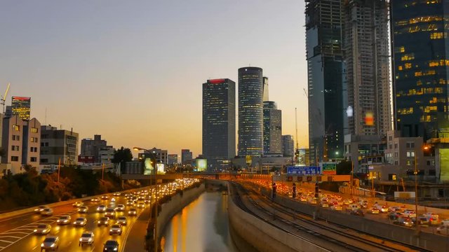 Time lapse - Central Tel Aviv skyline day to night with traffic