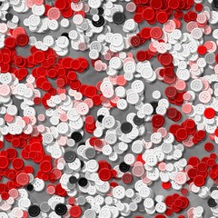 a lot of red, white, black and gray multi colored vintage clothing plastic buttons randomly scattered on the background - top view
